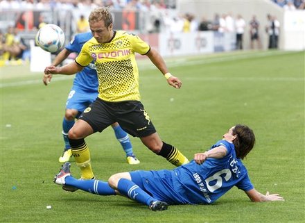 Hoffenheim''s Sebastian Rudy, Right, And Dortmund''s Mario Goetze Challenge For The Ball