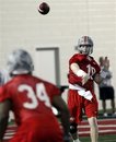 In this photo taken March 31, 2011, Ohio State quarterback Taylor Graham (19) throws a pass to Carlos Hyde (34) during the first day of spring NCAA college football practice in Columbus, Ohio. With three-year starter Terrelle Pryor sidelined for the spring after surgery and also facing a five-game suspension this fall, the Buckeyes are looking at four candidates to take his spot until he plays in his first game in October. Joe Bauserman, Kenny Guiton, Taylor Graham and Braxton Miller are sharing the snaps during spring workouts.