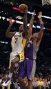 Los Angeles Lakers power forward Lamar Odom (7) drives to the basket against Phoenix Suns center Channing Frye (8) in the first half of an NBA basketball game in Los Angeles, on Sunday, Nov. 14, 2010.