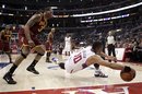 Los Angeles Clippers guard Eric Gordon , right, retrieves a loose ball as Cleveland Cavaliers guard Alonzo Gee watches during the second half of their NBA basketball game in Los Angeles,  Saturday, March 19, 2011. The Clippers won 100-92. (AP Photo)