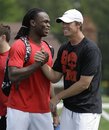 Atlanta Falcons rookie receiver Julio Jones , left, greets quarterback Matt Ryan before a football workout with teammates, Tuesday, May 24, 2011, in Buford, Ga. Jones was selected sixth overall in the first round of the NFL draft by the Falcons.