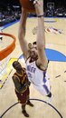 Oklahoma City Thunder center Byron Mullens , right, who was recalled from the NBA Development League prior to the game, dunks in front of Cleveland Cavaliers forward J.J. Hickson , left, in the fourth quarter of an NBA basketball game in Oklahoma City, Sunday, Dec. 12, 2010. Oklahoma City won 106-77.