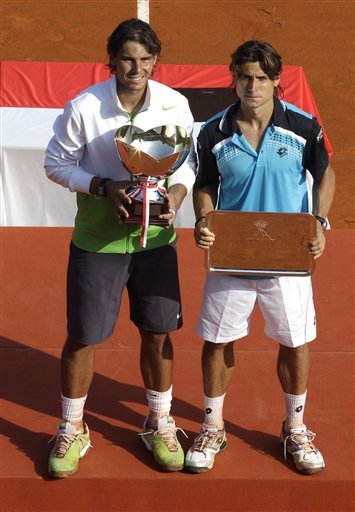 Rafael Nadal Of Spain, Left, Holds