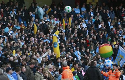 Manchester City Supporters Hold Inflatable Items, Inflatable Banana's Have Become A Traditional Item For Fans To