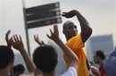 Los Angeles Lakers superstar Kobe Bryant , center, conducts a basketball clinic on Saturday Sept. 17, 2011 in Singapore. Bryant says he's still considering playing overseas as an owners' lockout of players threatens to sabotage the upcoming NBA season.