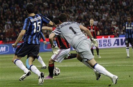 AC Milan Brazilian Forward Pato, Center, Scores As Inter Milan Brazilian Goalkeeper Julio Cesar, Right And Inter Milan