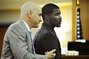 FILE - This Sept. 23, 2010, file photo shows former University of Missouri running back Derrick Washington, right, in court with his attorney, Christopher Slusher, after his bond hearing on a felony sexual assault charge and two counts of misdemeanor domestic assault, at the Boone County Courthouse in Columbia, Mo. Washington says he hopes to again play football this fall.
