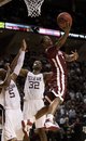 Oklahoma's Carl Blair, right, shoots the ball against Texas A&M defenders Dash Harris (5) and Kourtney Roberson (32) during the second half of an NCAA college basketball game, Wednesday, Feb. 23, 2011, in College Station, Texas. No. 21 Texas A&M won 61-47.