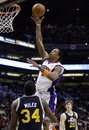 Phoenix Suns forward Channing Frye shoots over Utah Jazz forward C.J. Miles (34) during the third quarter of an NBA basketball game, Tuesday, Feb. 15, 2011, in Phoenix. The Suns won 102-101.