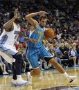 New Orleans Hornets guard Marco Belinelli (8), of Bologna, Italy, drives past Denver Nuggets center Nene (31), of Brazil, in the second half of an NBA basketball game in New Orleans, Friday, Oct. 29, 2010. The Hornets won 101-95.