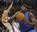 Dallas Mavericks center Brendan Haywood , right, collides with Oklahoma City Thunder center Nick Collison , left, as he shoots in the first quarter of an NBA basketball game in Oklahoma City, Wednesday, Nov. 24, 2010.