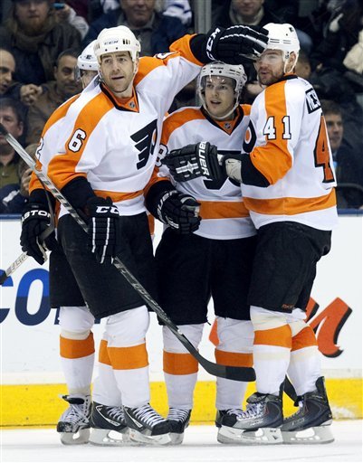 Philadelphia Flyers Right Winger Danny Briere, Center, Is Congratulated By Teammates Sean O'Donnell (6) And Andrej