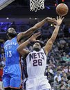 New Jersey Nets forward Stephen Graham , right, puts up a shot as Oklahoma City Thunder guard James Harden defends during the second quarter of an NBA basketball game Wednesday, Dec. 1, 2010, in Newark, N.J.