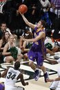 Tennessee Tech 's Zac Swansey, right, performs a layup against Michigan State 's Korie Lucious (34) during the first half of an NCAA college basketball game, Sunday, Nov. 28, 2010, in East Lansing, Mich.