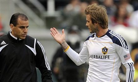 Los Angeles Galaxy Midfielder David Beckham, Right, Shows