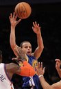 Golden State Warriors ' Stephen Curry , top, passes the ball during the second half of an NBA basketball game against the New York Knicks , Wednesday, Nov. 10, 2010, in New York. The Warriors won the game 122-117.