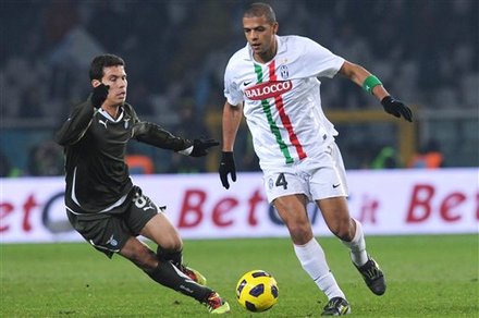 Juventus' Felipe Melo, Of Brazil, Right, Challenges