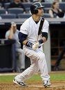 New York Yankees ' Nick Swisher watches his three-run home run during the second inning of an interleague baseball game against the Milwaukee Brewers on Tuesday, June 28, 2011, at Yankee Stadium in New York.