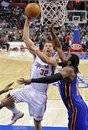 Los Angeles Clippers forward Blake Griffin , left, puts up a shot as New York Knicks center Ronny Turiaf defends during the first half of their NBA basketball game, Saturday, Nov. 20, 2010, in Los Angeles.