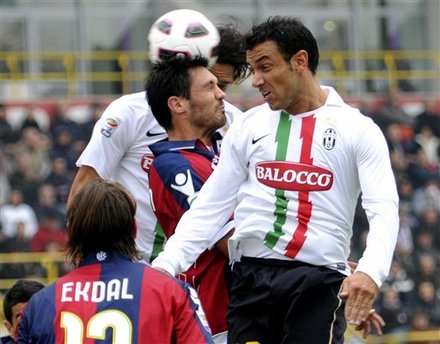 Juventus Forward Fabio Quagliarella, Right, And Bologna Austrian Defender Gyorgy Garics Battle For The Ball