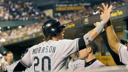 Florida Marlins' Logan Morrison (20) High-fives In The Dugout