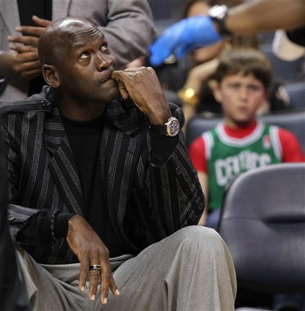 Charlotte Bobcats Majority Owner Michael Jordan, Left, Looks