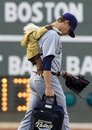 San Diego Padres pitcher Evan Scribner heads out to the bullpen while wearing an unusual backpack prior to an interleague baseball game against the Boston Red Sox at Fenway Park in Boston, Monday, June 20, 2011.