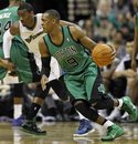 Boston Celtics guard Rajon Rondo drives with ball as he is covered by Washington Wizards guard John Wall in the second half of an NBA basketball game in Washington Saturday, Jan. 22, 2011. The Wizards won 85-83.