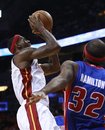 Miami Heat 's LeBron James , left, shoots as Detroit Pistons ' Richard Hamilton (32) defends in the first quarter of an NBA basketball game in Miami, Wednesday, Dec. 1, 2010.