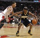 Indiana Pacers point guard T.J. Ford , right, pushes back on Chicago Bulls point guard Derrick Rose during the first half of an NBA basketball game Monday, Dec. 13, 2010, in Chicago. The Bulls won 92-73.