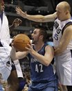 Dallas Mavericks center Brendan Haywood , left, and forward Brian Cardinal (35) right, defend against Minnesota Timberwolves forward Kevin Love (42) in the first half of an NBA basketball game Wednesday, Dec. 1, 2010, in Dallas.