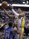 Indiana Pacers forward Danny Granger , right, shoots over Orlando Magic guard Jameer Nelson in the second half of an NBA basketball game in Indianapolis, Wednesday, Jan. 26, 2011. The Magic defeated the Pacers 111-96.