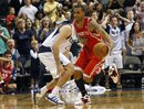 Houston Rockets ' Courtney Lee , right, makes a steal against the Dallas Mavericks during the second half of an NBA preseason basketball game in Dallas, Friday, Oct. 22, 2010. Dallas won 97-96.