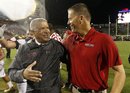 Maryland athletic director Kevin Anderson, left, speaks with head coach Randy Edsall after Maryland's 32-24 win over Miami in an NCAA football game in College Park, Md., Monday, Sept. 5, 2011.