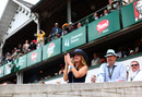 Racing fans react in the grandstand at Churchill Downs in Louisville, Kentucky on the afternoon of the 137th running of the Kentucky Derby in Louisville, Kentucky, on May 7, 2011. (Photo by Luke Sharrett/AFP/Getty Images)