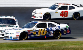 Contact with another car earlier this year at New Hampshire sends Ricky Stenhouse Jr. spinning into the path of Trevor Bayne, who is able to steer clear of his teammate and friend. (Getty Images)
