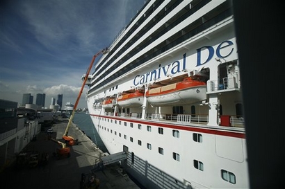 Last minute supplies and luggage is loaded aboard the the Carnival ship,