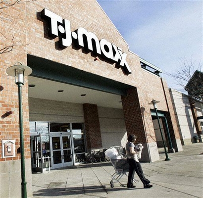 A shopper leaves a T.J. Maxx store in Framingham, Mass. Wednesday, Feb. 21, 2007. (AP Photo/Elise Amendola)