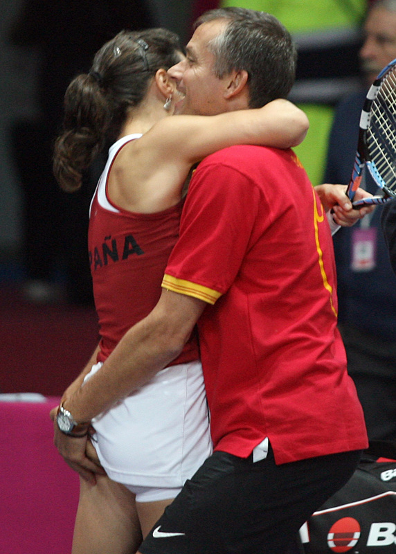 Spanish Nuria Llagostera Vives celebrates with her coach Miguel Margets Lobato after winning the match against Italian Francesca Schiavone during the first round of FED CUP quarter final match in Naples, 02 February 2008. Vives won 7-6, 3-6, 6-2.   AFP/MARIO LAPORTA (Photo credit should read MARIO LAPORTA/AFP/Getty Images)