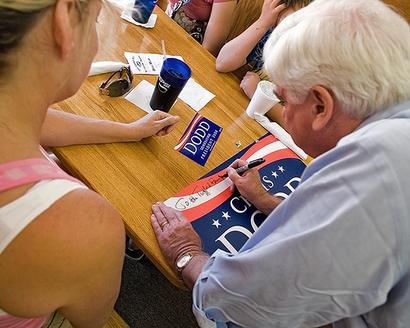 Senator Chris Dodd, Democratic Presidential hopeful, signs a ...